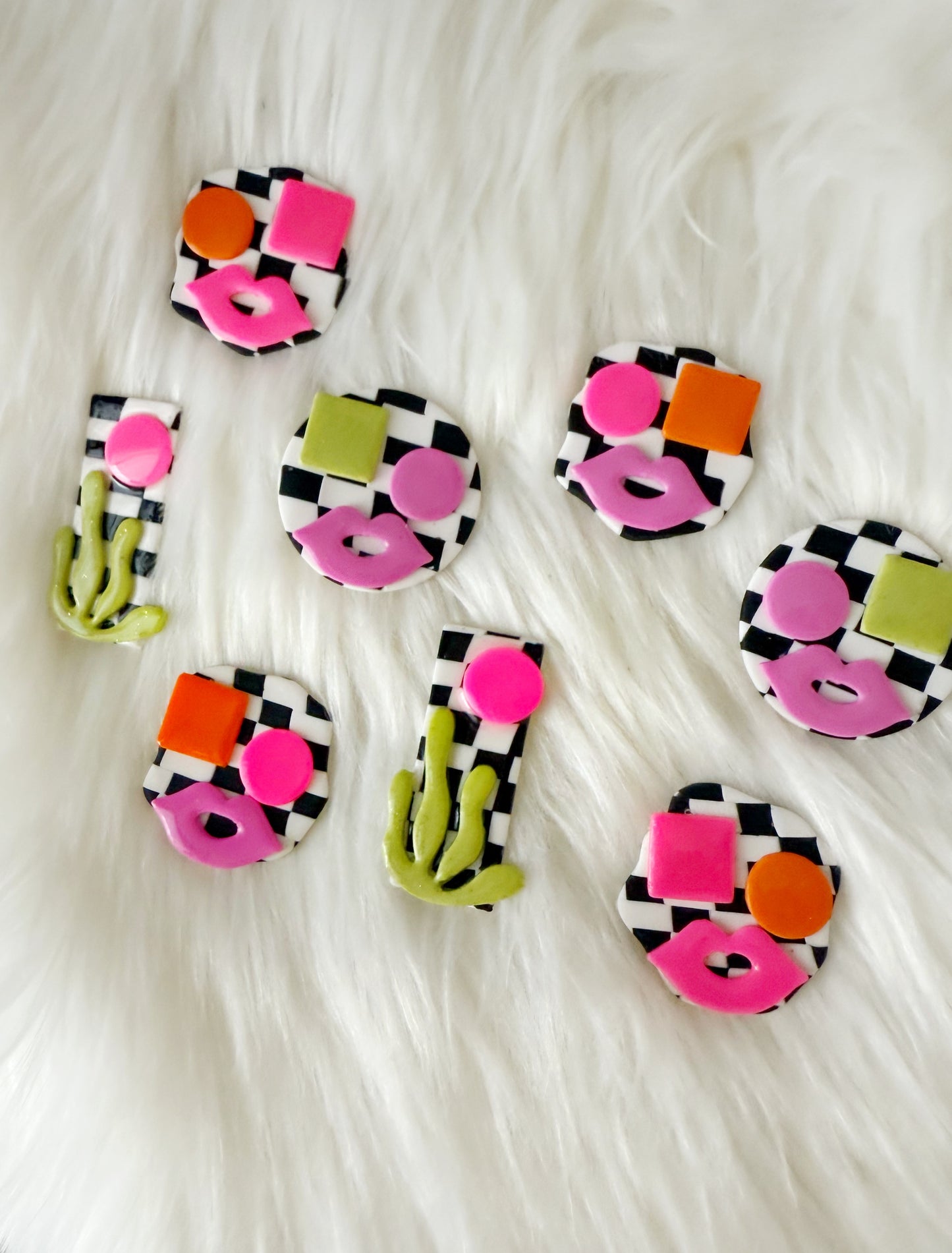Avant-Garde Polymer Clay Abstract Faces Earrings: Black & White Checkered Background with Vibrant Pink and Orange Details- Unique polymer clay Studs