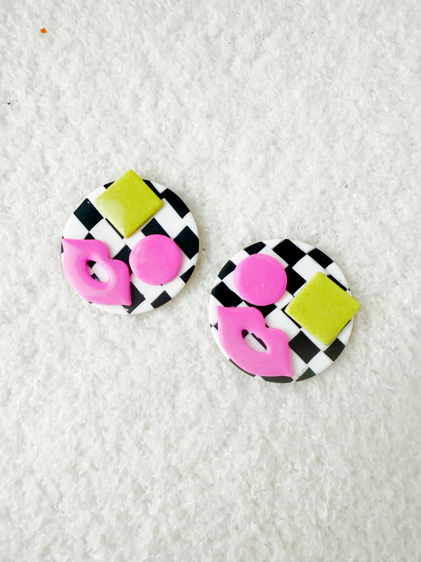 Avant-Garde Polymer Clay Abstract Faces Earrings: Black & White Checkered Background with Vibrant Pink and Orange Details- Unique polymer clay Studs
