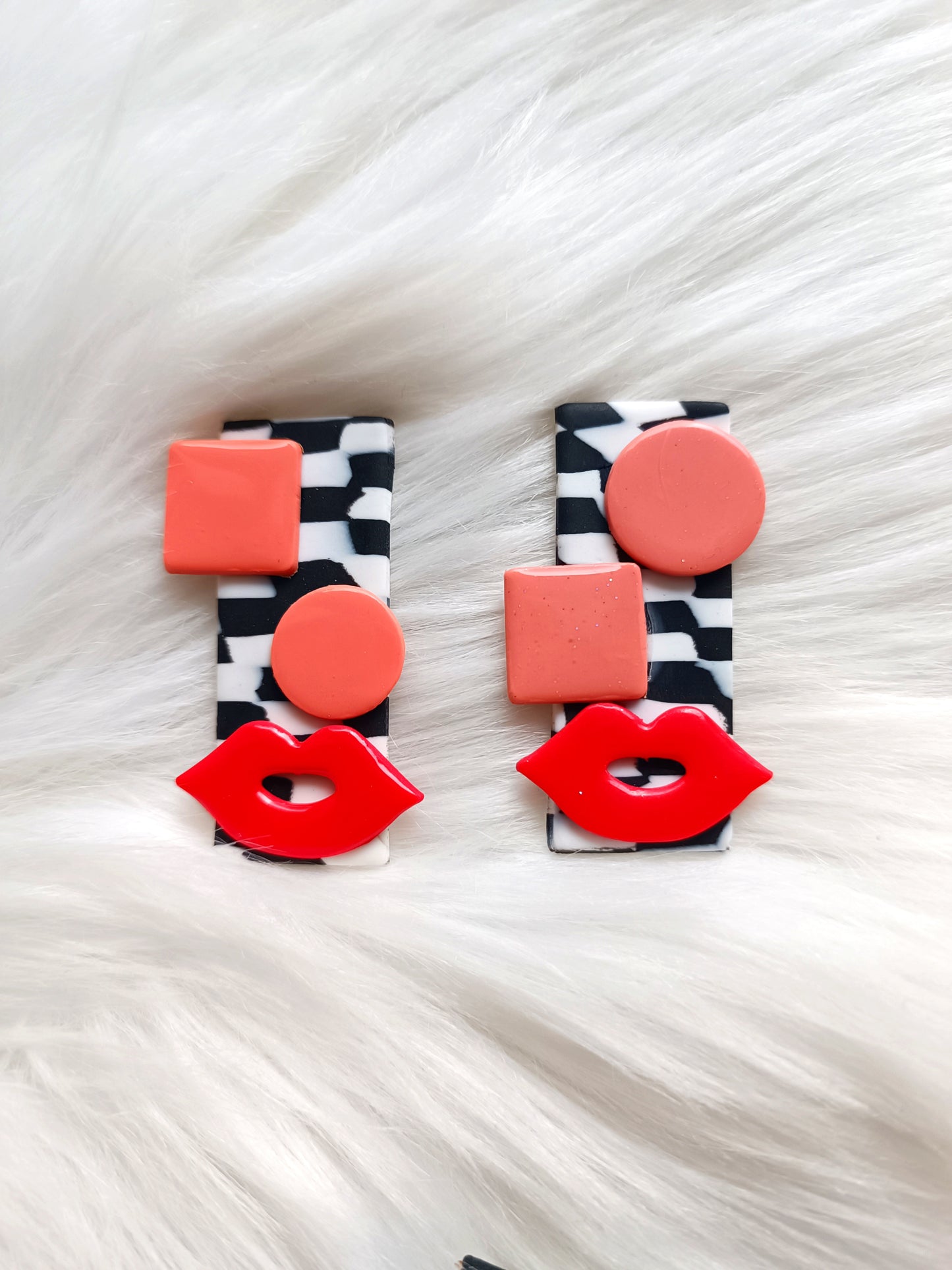 Avant-garde polymer clay earrings - abstract faces on black and white checkered background 👄 Red lips studs