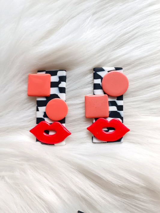 Avant-garde polymer clay earrings - abstract faces on black and white checkered background 👄 Red lips studs